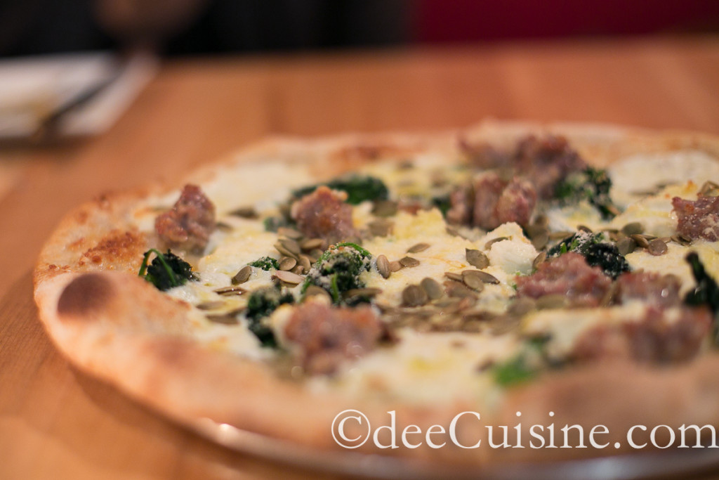 Sausage Pizza with broccoli rabe, ricotta, pepitas