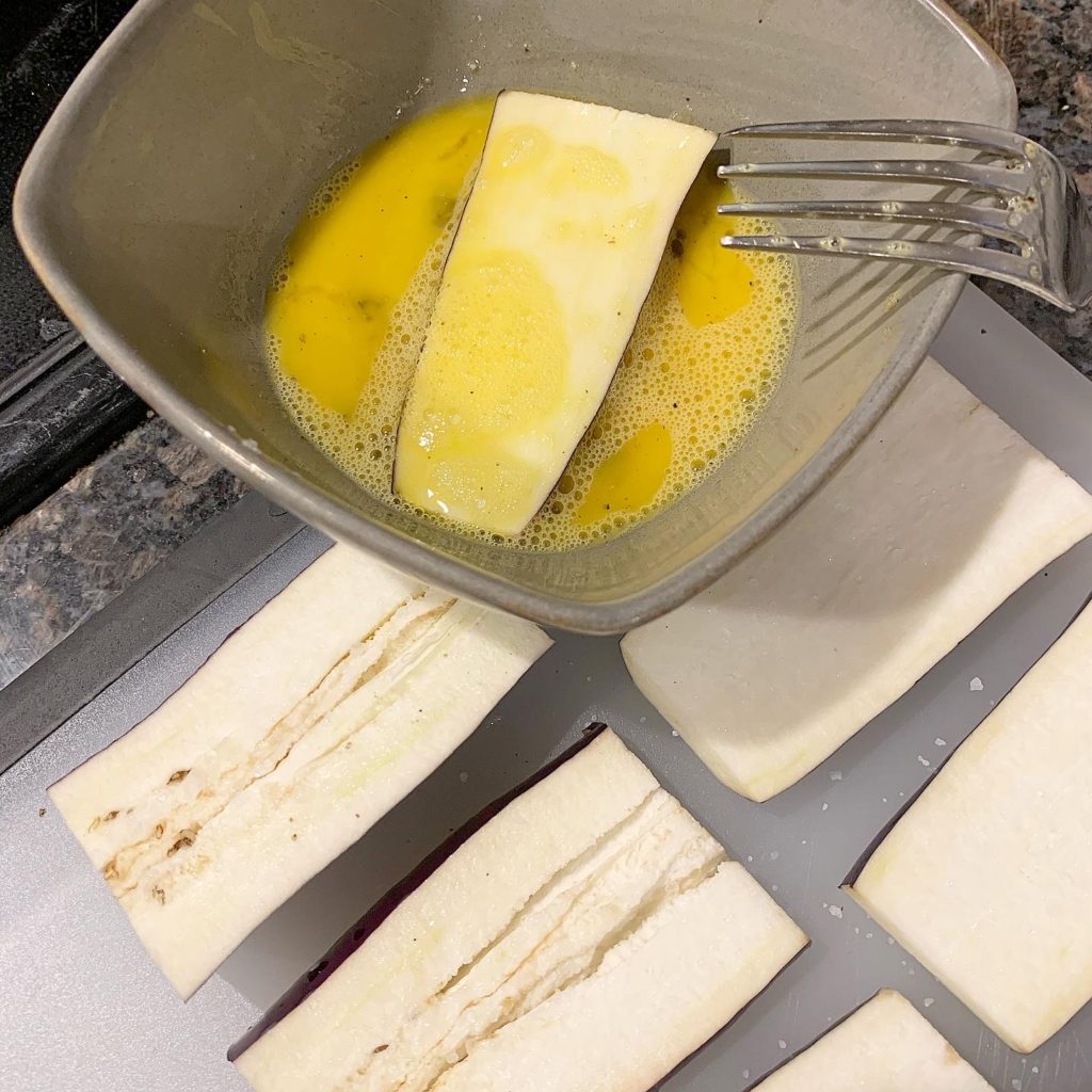 Dip eggplant in egg